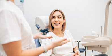 lady smiles at dentist