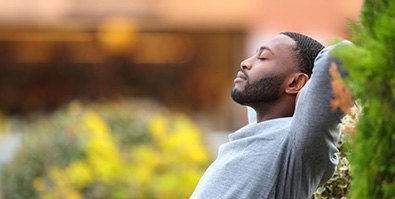 a man sitting outside and resting