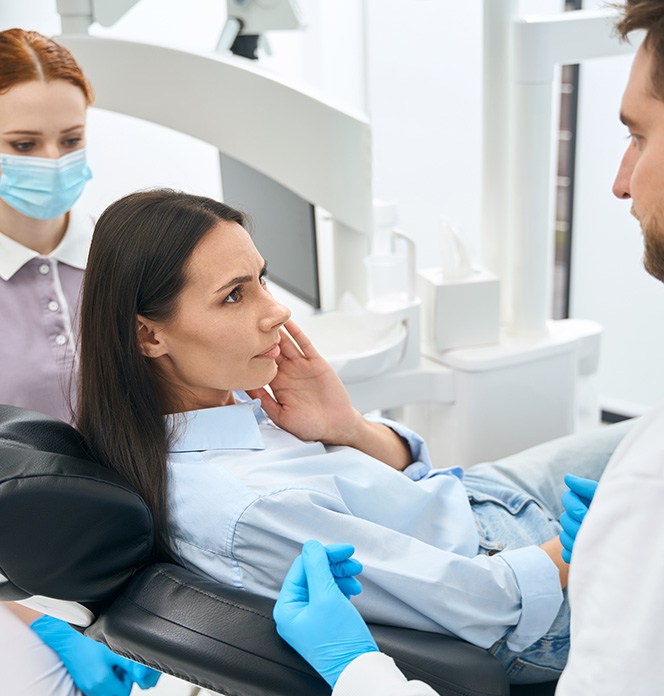 Woman at the dentist with tooth pain