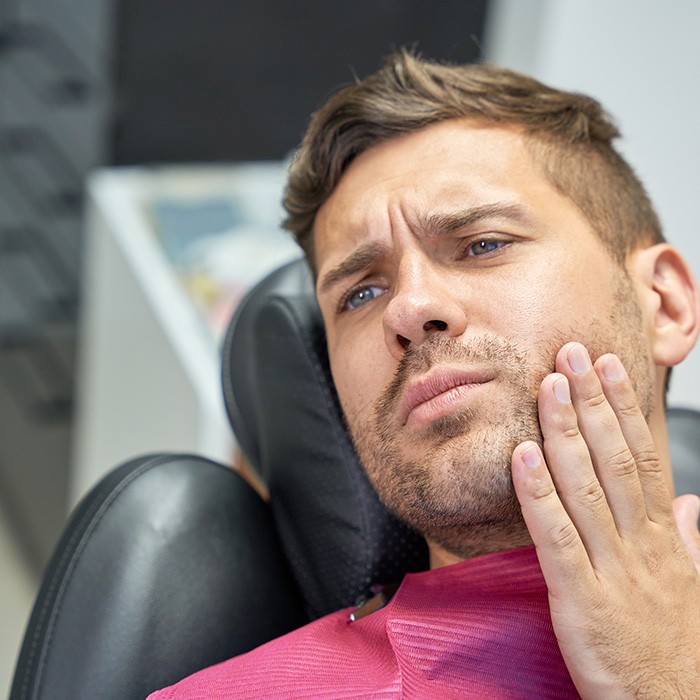 Man at the dentist with a toothache